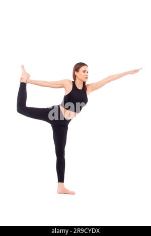 30s Caucasian fit woman doing yoga exercise in sportswear, king dancer pose, natarajasana, isolated on white color Stock Photo