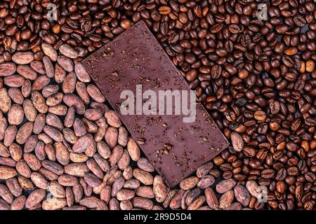 Organic dark chocolate bar, cacao nibs and coffee beans as background Stock Photo