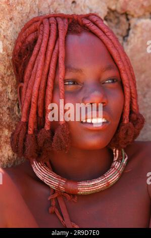Himba Woman, Village near Serra Cafema Wilderness Safaris at Kunene River, Kunene Region, Namibia Stock Photo