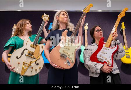 Bonhams, Knightsbridge, London, UK. 26th June, 2023. Founding member of Fleetwood Mac, Peter Green (1946-2020) amassed a large range of more than 150 guitars, as well as other equipment. This impressive collection of individual items is offered by his Estate for the first time with the bidding ending 28 June. Left and centre: Gretsch White Falcon 6137 Stereo Semi-Acoustic, 1968, estimate £6,000-8,000; Fender Stratocaster, c. 1996, estimate £3,000-4,000. Credit: Malcolm Park/Alamy Live News Stock Photo