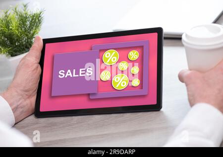 Tablet screen displaying a sales and discounts concept Stock Photo - Alamy