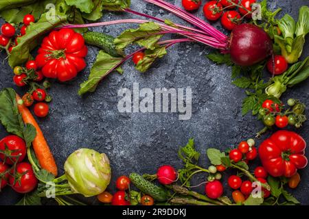 Fresh different vegetables  on  a black background. Top view Stock Photo