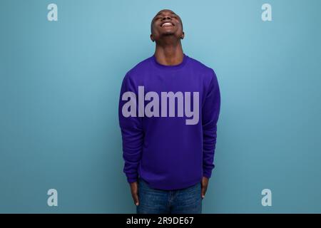 nice kind 30s american man dressed in a blue jacket on the background with copy space Stock Photo