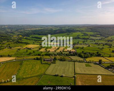 Aerial drone view of the countryside in North-Yorkshire England. There is a lot of farmland in the Yorkshire Dales. Stock Photo