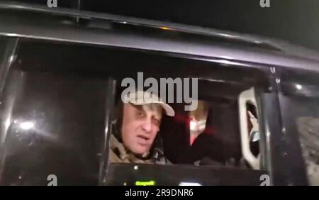 Rostov-on-Don, Ukraine. 25 June, 2023. A screen grab of Russian oligarch Yevgeny Prigozhin, owner of the Wagner Group of mercenaries as he departs by vehicle after reaching an agreement to halt his march on Moscow, June 25, 2023 in Rostov-on-Don, Russia. Prigozhin ended his rebellion against Moscow and agreed to safe haven in Belarus.  Credit: Pool Photo/Wagner Group/Alamy Live News Stock Photo