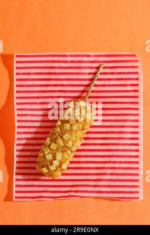 Delicious Crunchy Korean Style Chunky Potato Corn Dogs with Batter and Fried Potatoes. Stock Photo