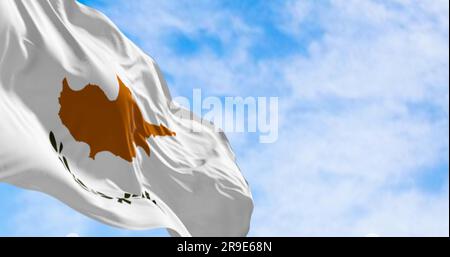 Cyprus national flag waving in the wind on a clear day. White with a copper-orange island silhouette and two green olive branches below it. 3d illustr Stock Photo