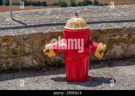 Red painted, short fire hydrant, Kefalonia,Greece Stock Photo
