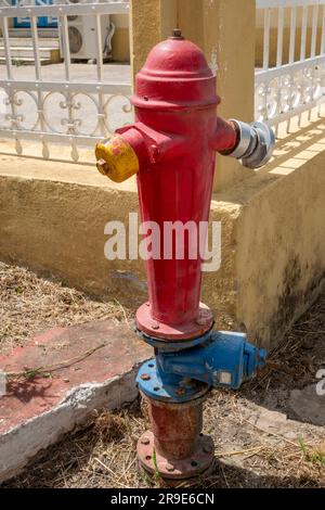 Red painted fire hydrant, Kefalonia,Greece Stock Photo