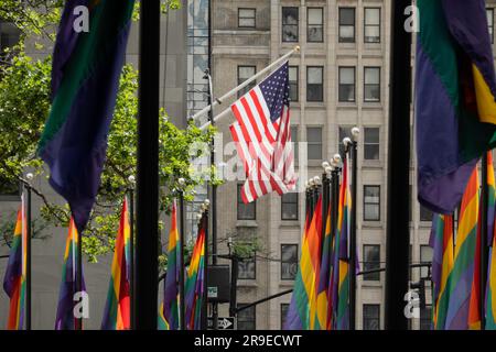 Pride month flags surround the plaza in Rockefeller Center, New York ...