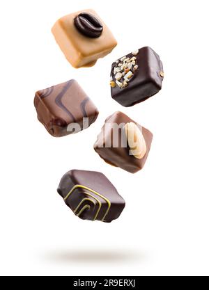 Assorted chocolate pralines floating on white background Stock Photo