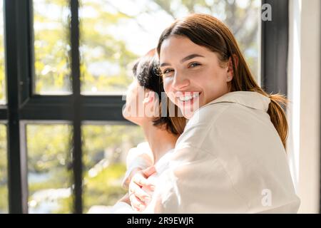 Portrait of happy young couple spending time together at home Stock Photo