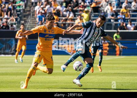 Pachuca defender Gustavo Cabral (22) is defended by UANL Tigres forward ...