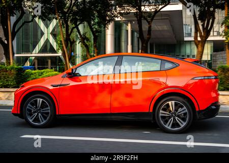 An XPeng G6 Performance electric SUV car being driven on a test drive in Guangzhou, Guangdong Province, China. Stock Photo