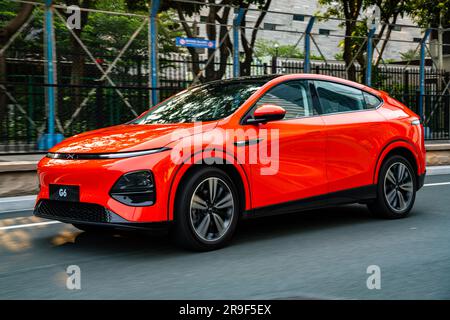 An XPeng G6 Performance electric SUV car being driven on a test drive in Guangzhou, Guangdong Province, China. Stock Photo