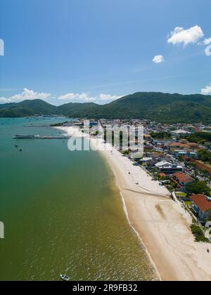 An aerial view of a coastal beach with a row of beachfront homes in Balneario Camboriu Stock Photo