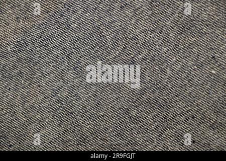 gray denim fabric as background close up Stock Photo