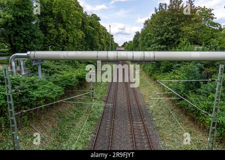 New district heating pipeline of STEAG in Essen, over the railway tracks of line S6 in Essen-Süd, part of the new 12 km long eastern route through the Stock Photo