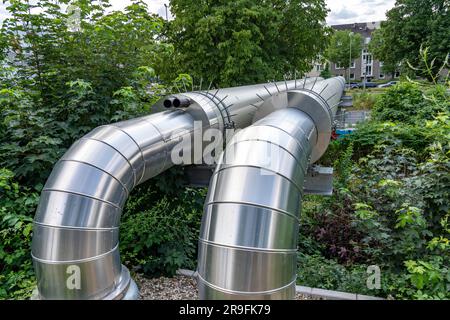 New district heating pipeline of STEAG in Essen, over the railway tracks of line S6 in Essen-Süd, part of the new 12 km long eastern route through the Stock Photo