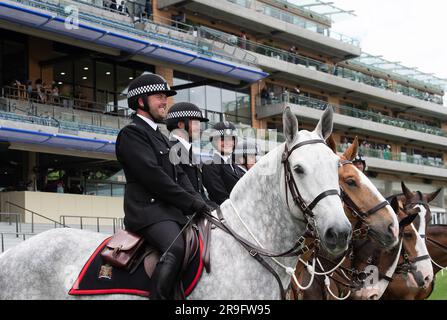 Ascot, Berkshire, UK. 24th June, 2023. Thames Valley Police Mounted Section police officers and horses on duty on the racetrack at Ascot Racecourse during Royal Ascot week. Credit: Maureen McLean/Alamy Stock Photo