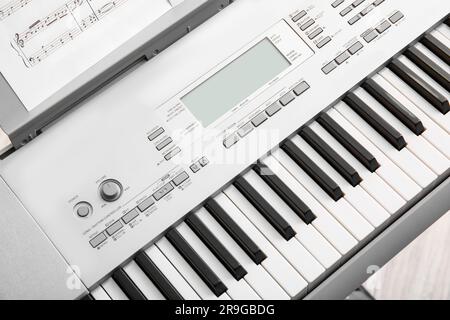 Modern synthesizer in room, closeup Stock Photo