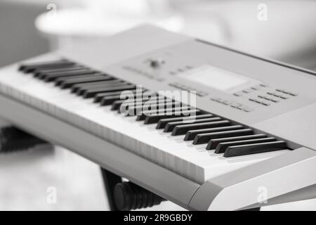 Modern synthesizer in room, closeup Stock Photo