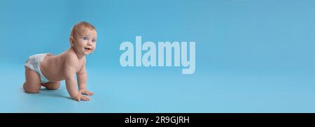 Cute baby in diaper crawling on light blue background, space for text. Banner design Stock Photo