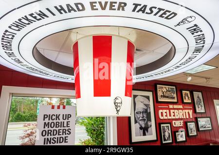 Alma Georgia,KFC fast food Kentucky Fried Chicken,giant bucket Colonel Sanders,inside interior indoors,restaurant Stock Photo