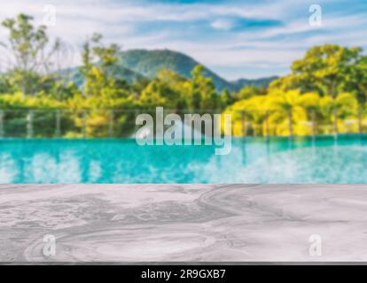 Beautiful marble table or desk floor, little shiny surface, perspective view, the background of rooftop swimming pool and mountain scape and sky, Empt Stock Photo
