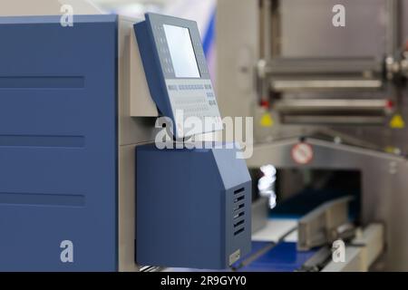 Control console of automatic industrial weigh price labeling machine. Selective focus. Stock Photo