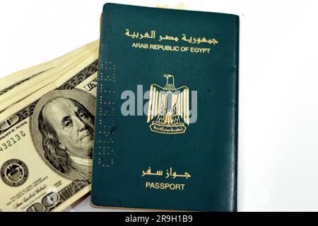 Egyptian passport with American dollars of 100 one hundred United states dollars money banknotes, Arab republic of Egypt's passport with the republica Stock Photo