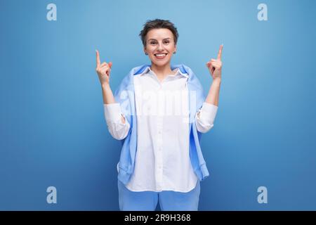 authentic young fashionable dark haired woman with a wide smile Stock Photo