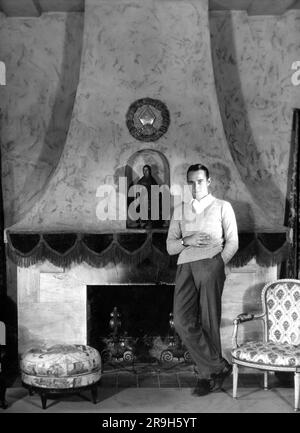 WILLIAM HAINES 1927 Full Length Portrait by RUTH HARRIET LOUISE at his HOLLYWOOD home Silent / early Sound Movie Star publicity for Metro Goldwyn Mayer Stock Photo