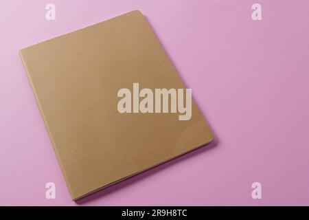 Close up of beige notebook with copy space on pink background Stock ...