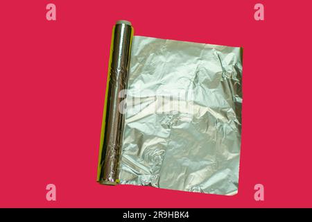 aluminum foil on viva magenta background , kitchen tools and utensils, aluminum foil used in kitchen, aluminum foil pictures in different concepts Stock Photo