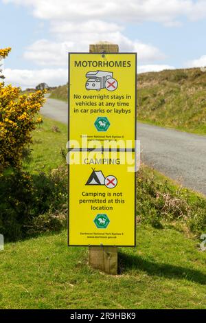 Signs warning of restrictions on camping and overnight stays in motorhomes, Dartmoor, Devon, England, UK Stock Photo