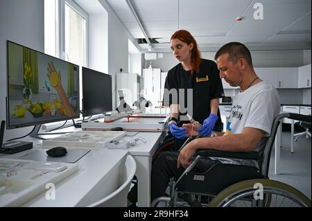 Non Exclusive: LVIV, UKRAINE - JUNE 23, 2023 - Serviceman of the Azov Regiment Oleksandr who partially lost his eyesight goes through the Squeeze the Stock Photo