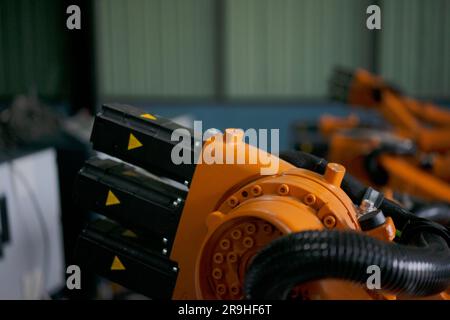Engineer work at robotic arm factory. Technology and engineering concept. Stock Photo