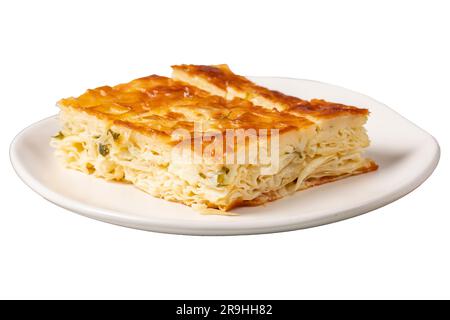 Turkish Su Boregi or Tabla borek with cheese. Turkish Patty isolated on white background. Close up Stock Photo