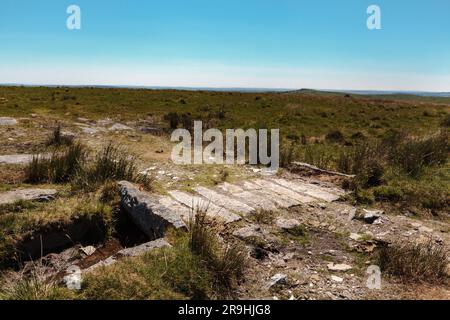 Merrivale Prehistoric Settlement, western Dartmoor, Princetown, Yelverton, Devon, England, UK: granite slabs bridging a leat Stock Photo