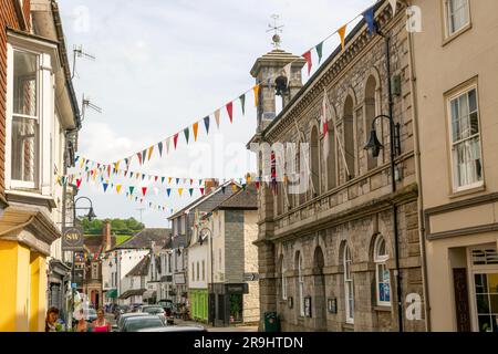 Bunting corsing street between Town hall and shops, Ashburton, south Devon, England, UK Stock Photo