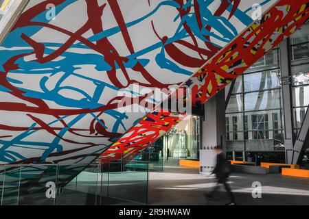 London, UK. 27th June, 2023. General public interact with Arturo Herrera's Untitled, 2022, on the underside of the escalators at the iconic Leadenhall building. The 12th edition of Sculpture in the City outdoor sculpture trail in the City of London returns with 18 artworks on free display. Credit: Imageplotter/Alamy Live News Stock Photo