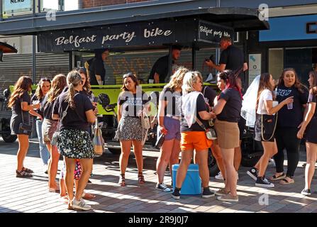 Hen Party of young women, boarding a Belfast party bike, in the city centre, Fountain St, - world of pain say PSNI Stock Photo