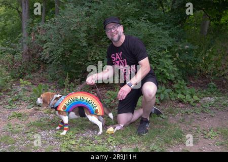 Roxy the beagle and her owner, participants in the Pet Pride Parade at the Pride in the Park event in Lewisboro, Westchester, New York. Stock Photo