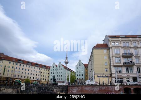 Berlin, Germany - April 19, 2023 : View of the statue Saint George the Dragon slayer, residential buildings and the Nikolai Church in the background Stock Photo