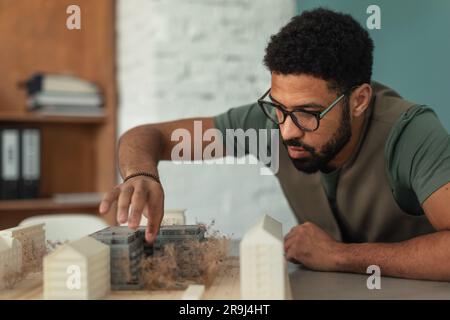 Young architect hard working on design of new house, building. Stock Photo