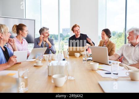 Confident team of business professionals having team meeting Stock Photo