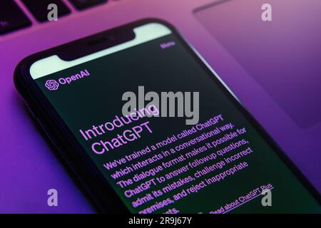 Antalya, Turkey - May 8, 2023: ChatGPT chatbot interface, utilizing the latest in artificial intelligence technology from Open AI, is easily accessible on a mobile phone screen in neon light.  Stock Photo