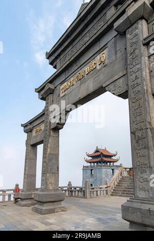Sa Pa, Vietnam-April 2023; Low angle view of entrance gate on the summit of Fanxipan Mountain leading to the bronze Great Amitabha Buddha statue Stock Photo
