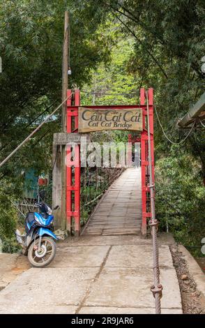 Cat Cat Village, Sapa, Vietnam-April 2023; Vertical view of the bridge that gives access to the traditional village of Cat Cat known for its Water whe Stock Photo